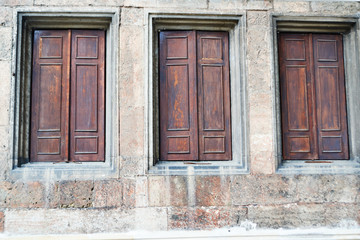window closed wooden doors in ancient castle wall