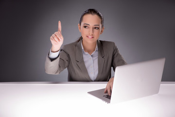 Young businesswoman working with laptop in business concept