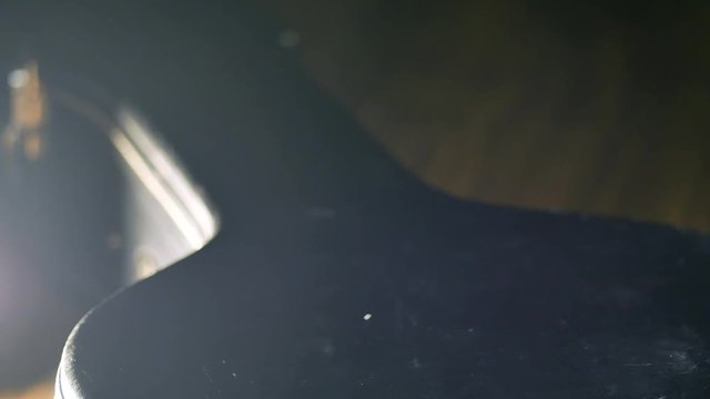 A man takes an electric guitar