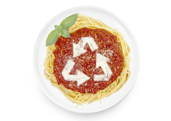Dish of pasta with parmesan cheese shaped as arrows of recycling