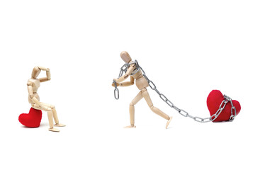 Wood Figure Mannequin using a chain to pull a big red heart for his lover