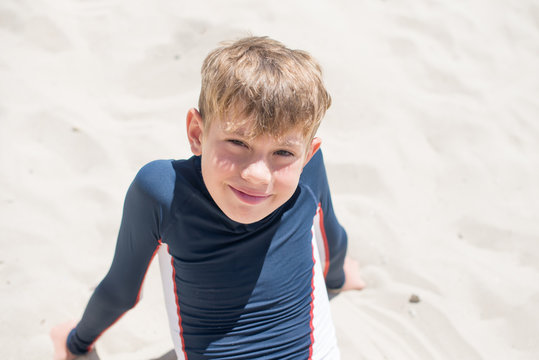 Boy sitting on beach, Nesebar, Bulgaria