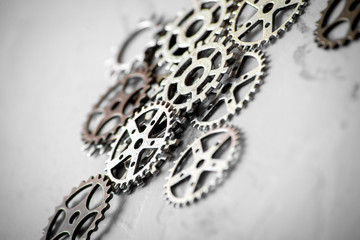concept hour metal gears on gray background top view