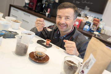 Man testing different types of coffee