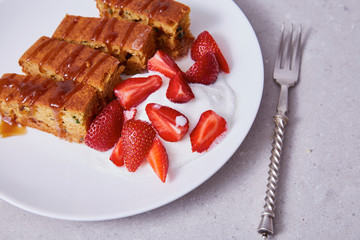 White ceramic china plate silver steel fork slices cake