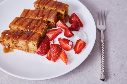 White ceramic china plate silver steel fork slices cake - Powered by Adobe