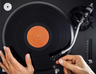 Turntable, Hand Holding and Scratching Record, Top View