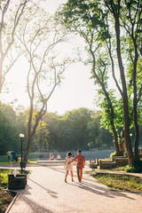 couple relax in park at sunset