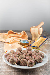 Raw meatballs ready to be skewered 