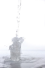 Naklejka na ściany i meble water splashing from glass isolated on white background