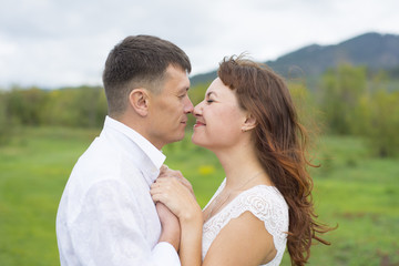 Lovers man and woman on a date in nature.