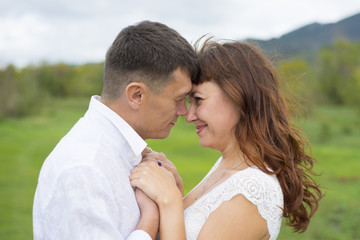 Lovers man and woman on a date in nature.