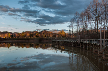 Lake Reflection at Sunset with Pier Dock Foot Path