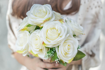 Hands holding bouquet of flower