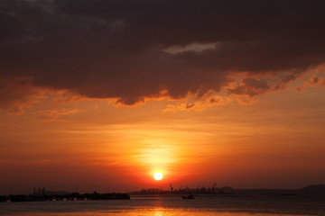 Fototapeta na wymiar Sunset and storm cloud in evening
