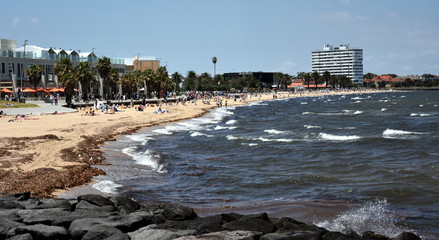 St Kilda, Australia - December 30, 2016. Hot sunny day in summertime on St Kilda beach. St Kilda beach in Melbourne is a popular place for swimming in the sea. © katacarix