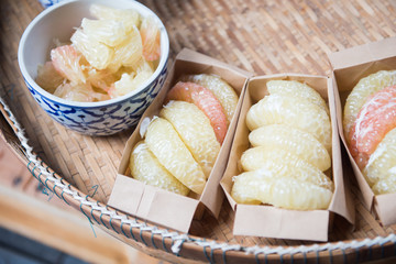 peeled grapefruit in paper box