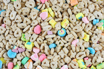 Fototapeta na wymiar oat cereal background with colorful marshmallows
