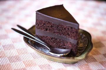 eating sweet lifestyle. brownie chocolate cake in the cafe table
