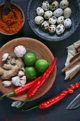 Top view of healthy spices and food ingredients on the black background