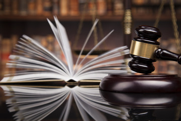 Law books, mallet of the judge, Courtroom background