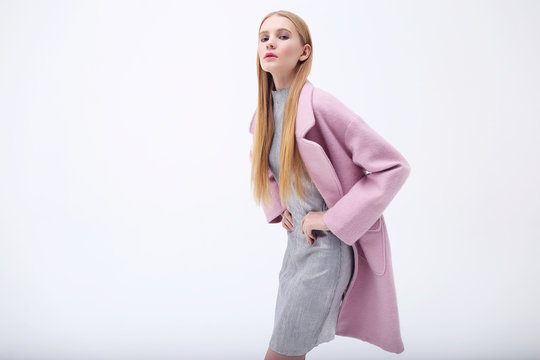 Young Elegant Woman In Trendy Pink Coat.