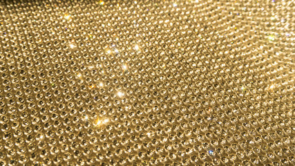 Blurred diamond, crystal glitter lights background, golden holid