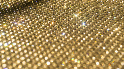 Blurred diamond, crystal glitter lights background, golden holid