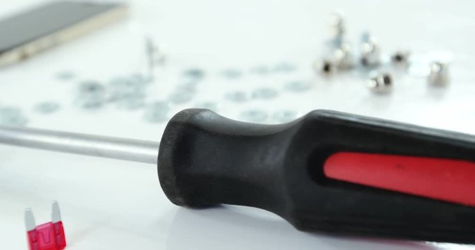 Close-up of screwdriver and screws
