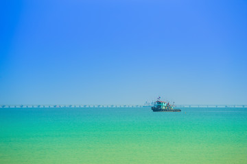 sea with the Thai fishing boat with sky