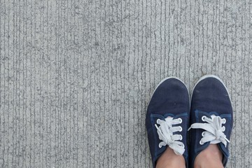 Top view of sneaker standing on the cement floor background and