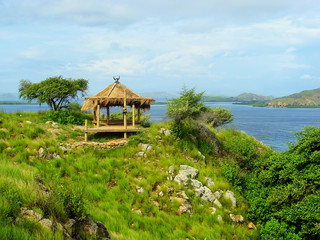 Small hut on a hill at Kanawa Island in Flores Sea, Nusa Tenggar