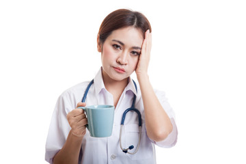 Portrait of Asian young female doctor got headache.