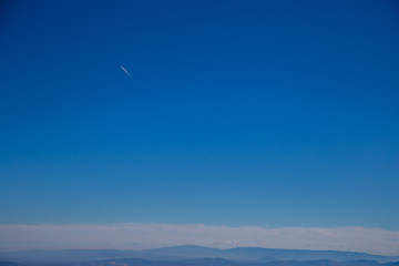 Mountains, sky and a plane