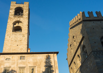 Fototapeta na wymiar Bergamo - Old city (Citta Alta). One of the beautiful city in Italy. Lombardia. The clock tower called Il Campanone (the big bell) during a wonderful blue sky.