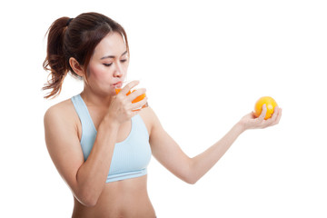 Beautiful Asian healthy girl with orange juice and orange fruit.