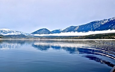 Blue lake and mountains. Upper Arrow lake. Columbia River.  Selkirk and Monashee Mountains.  Keenleyside Dam. Castlegar. Revelstoke. British Columbia. Canada.