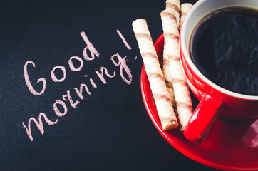 Cup of Coffee and Cookie on a Dark Background. Inscription Good Morning.
