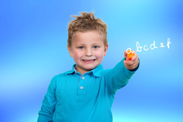 3 years old child point orange pen