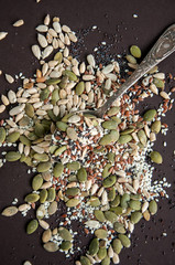 Variety of seeds over dark background