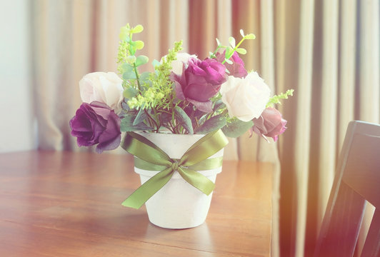 Fake flowers in vase vintage instagram effect style