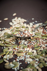 Variety of seeds over dark background