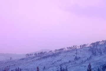 View of snow-covered mountains on a cold day