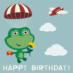 Happy birthday! Funny frog flying on parachute with gift and flower. Birthday card with frog in cartoon style.