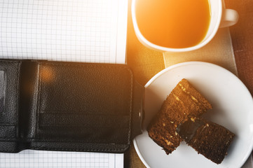 Сoffee mug, cake, notebook