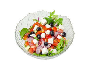 Greek salad in a glass salad bowl