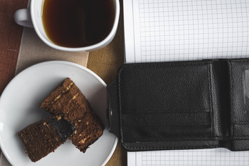 Сoffee mug, cake, notebook