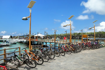 Fototapeta na wymiar Bicycle parking on the waterfront in Puerto Ayora, Santa Cruz Is