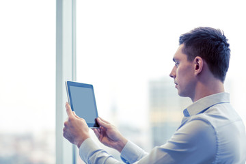 businessman with tablet pc in office