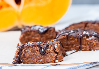 Pumpkin vegan brownie with a chocolate. Love for a healthy desserts concept.
